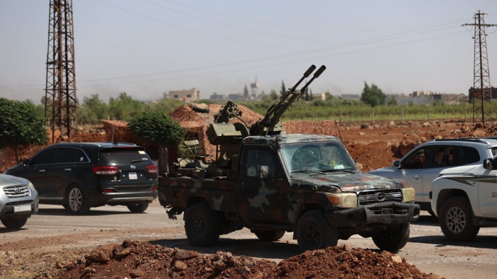 Syrian military members arrive to patrol the area as clashes between Druze and Bedouin Arab tribes continue in the southern Syrian province of Al-Suwayda, bordering Jordan, on July 14, 2025.  (AA Photo)