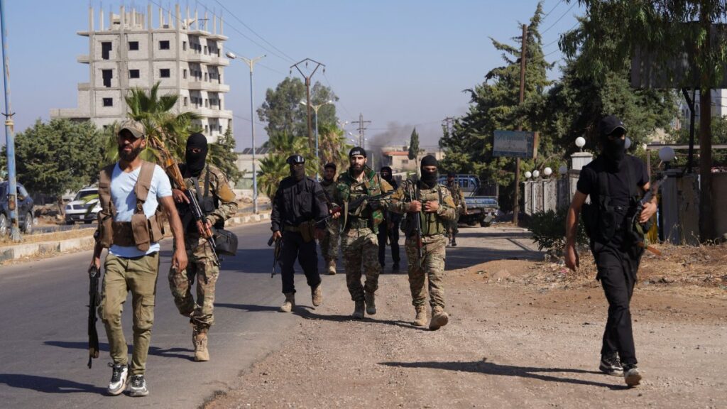 Members of Syrian security forces walk together after Syrian troops entered the predominantly Druze city of Suwayda, Syria, July 15, 2025. (Reuters Photo)