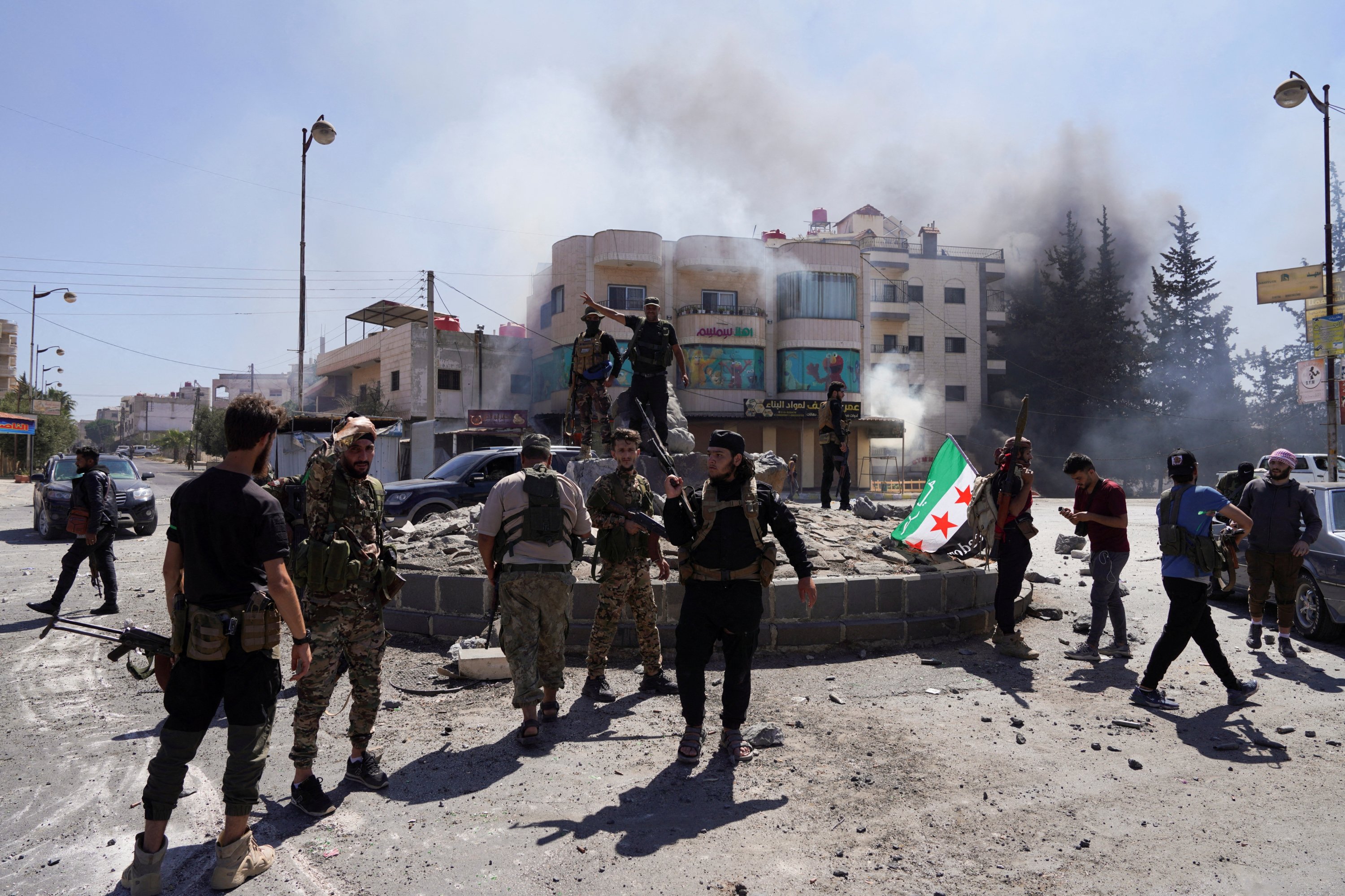 391729 Members of Syrian security forces stand together after Syrian troops entered the predominantly Druze city of Suwayda, Syria, July 15, 2025. (Reuters Photo)