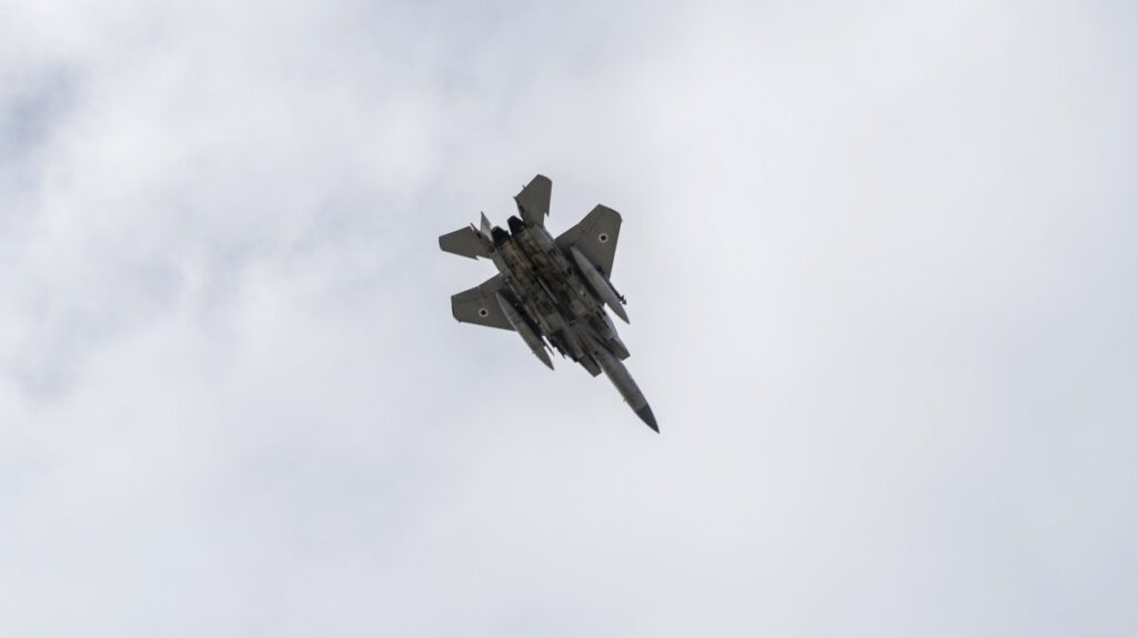 An Israeli fighter jet flies over Beirut during the funeral procession of Lebanon's former Hezbollah leaders, Hassan Nasrallah and his cousin and successor, Hashem Safieddine, in Beirut, Lebanon, Feb. 23, 2025. (AP Photo)
