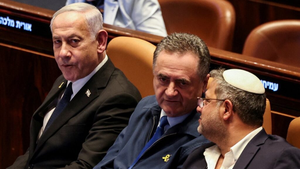 Israeli Prime Minister Benjamin Netanyahu sits in the Knesset, Israel's parliament, next to Defense Minister Israel Katz and National Security Minister Itamar Ben-Gvir on the day of a vote over possible expulsion of Ayman Odeh from parliament, in Jerusalem, July 14, 2025. (Reuters File Photo)