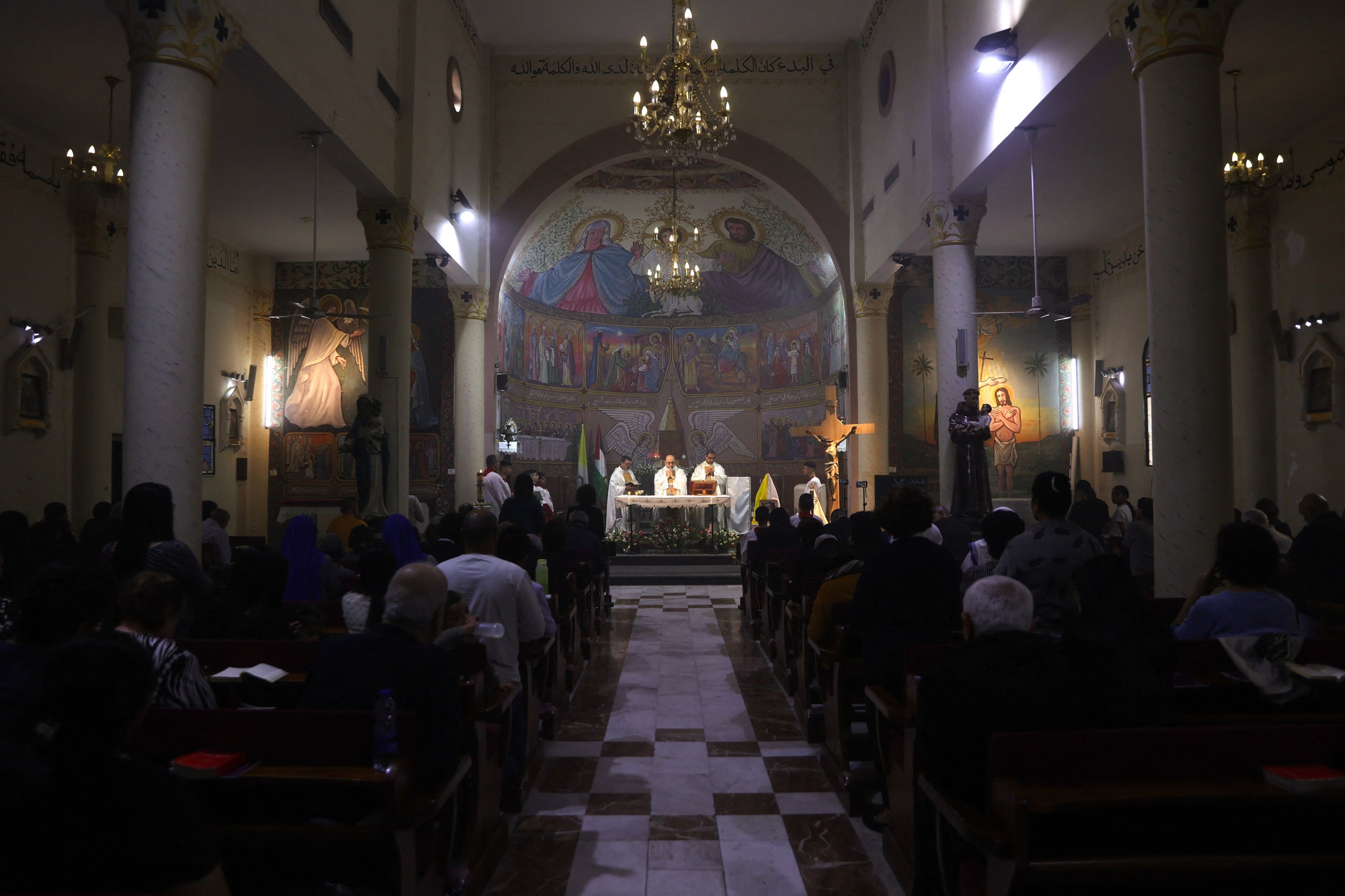 392103 Members of the clergy hold mass for late Pope Francis at the Holy Family Church in Gaza City, central Gaza, Palestine, April 21, 2025. (AFP Photo)