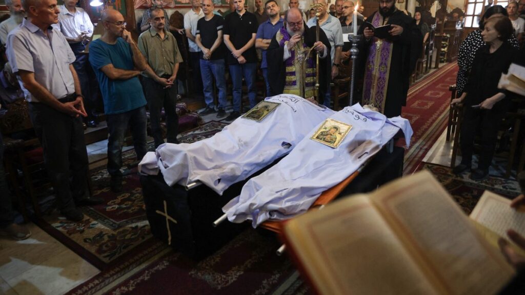 Archbishop Alexios blesses the bodies of Saad Salameh and Foumia Ayyad, killed earlier in an Israeli strike that hit the Holy Family church, Gaza City, Palestine, July 17, 2025. (AFP Photo)