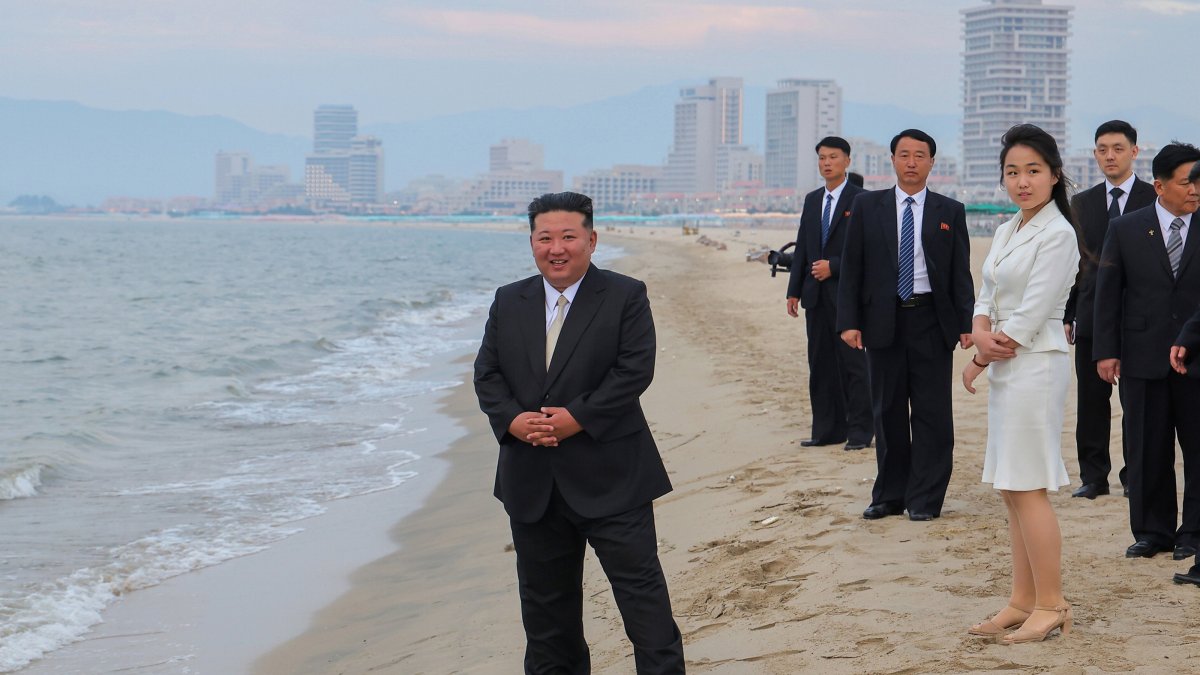 North Korean leader Kim Jong Un (L) and his daughter Kim Ju Ae (3rd R) stand on a beach during a ceremony marking the opening of the Wonsan Kalma Coastal Tourist Zone, Wonsan, North Korea, June 24, 2025. (EPA Photo)