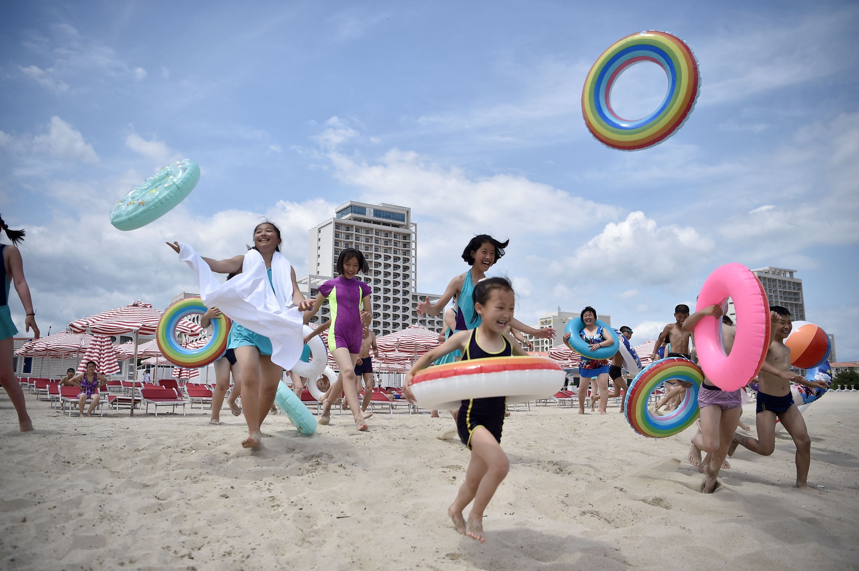 392362 Domestic tourists visit the beach at Wonsan Kalma Coastal Tourist Area, Wonsan, North Korea, July 1, 2025. (AFP Photo)