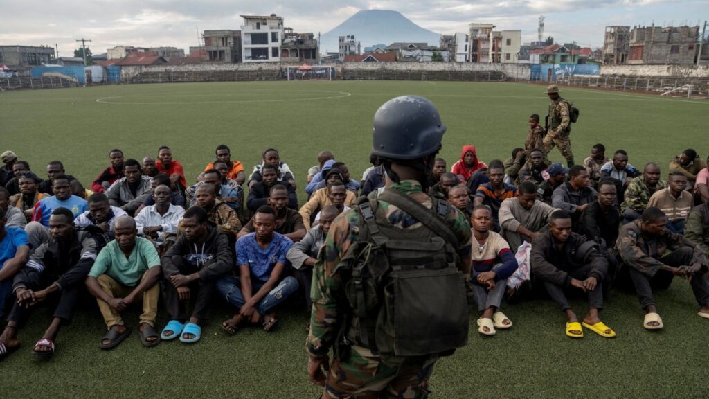 A M23 rebel stands guard at the the Unite stadium as members of the armed forces of the Democratic Republic of the Congo (FARDC) and Wazalendo troops wait to be taken aboard trucks for training by M23 rebels, in Goma, North Kivu, Democratic Republic of Congo, May 10, 2025. (Reuters Photo)