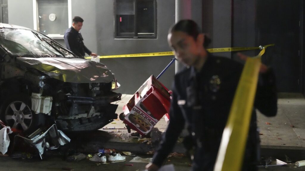 Law enforcement investigate the scene where a vehicle rammed into a crowd of people waiting to enter a nightclub along a busy boulevard in Los Angeles, July 19, 2025. (AP Photo)