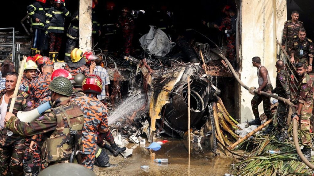 Bangladeshi emergency workers conduct a search and rescue operation after an air force training jet crashed into a school in Dhaka, Bangladesh, July 21, 2025. (AFP Photo)