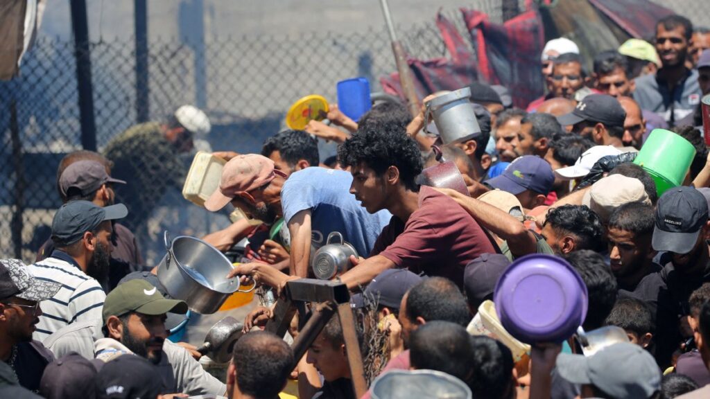 Palestinians gather at a food distribution point in the Nuseirat refugee camp in the central Gaza Strip, Palestine, July 19, 2025. (AFP Photo)