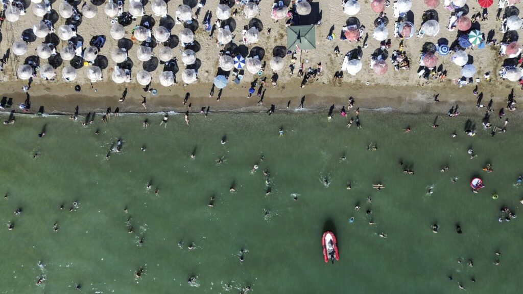 An aerial photo taken with a drone shows people cooling off in the Marmara Sea during a heat wave, Kocaeli, northwestern Türkiye, July 20, 2025. (EPA Photo)