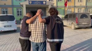 Police officers detain a suspect wanted for a 1984 murder in Germany during a coordinated operation, Hatay, Türkiye, July 24, 2025. (IHA Photo)