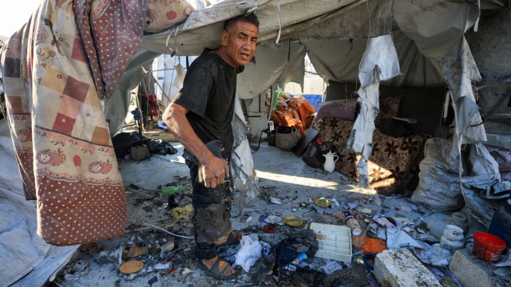 A Palestinian man inspects the damage at the site of an overnight Israeli strike on a tent sheltering displaced people, in Gaza City, central Gaza, Palestine, July 24, 2025. (Reuters Photo)