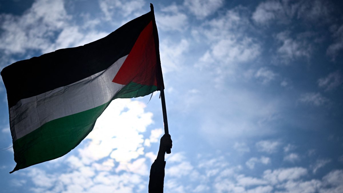 A protester holds a Palestinian flag during a rally called by several French organisations in support of the Palestinian people at Place de la Republique in Paris, France, May 7, 2024.