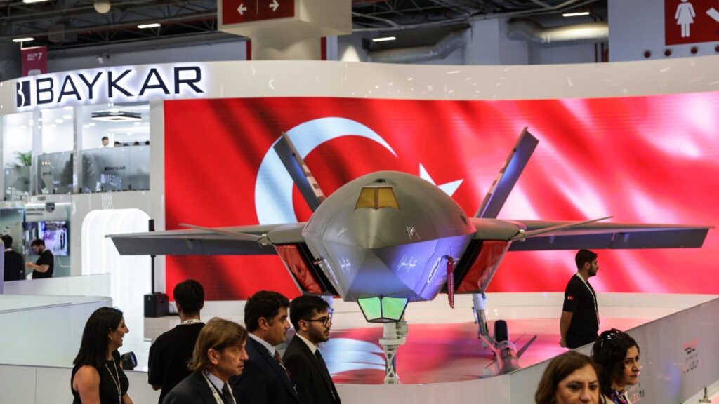 People pass by Baykar's unmanned fighter jet Bayraktar Kızılelma during the International Defence Industry Fair (IDEF), Istanbul, Türkiye, July 22, 2025. (EPA Photo)