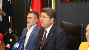 Justice Minister Yılmaz Tunç is seen with Justice and Development Party (AK Party) officials in Adana, Türkiye, July 24, 2025 (AA Photo)