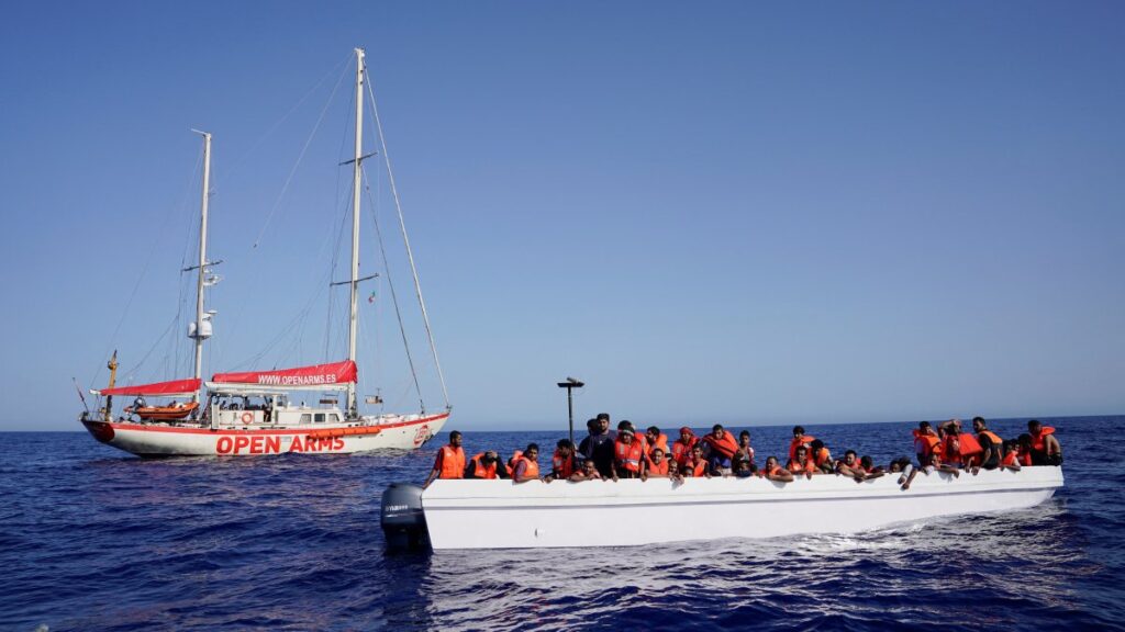 Migrants on a fiberglass boat wait to be assisted by NGO Open Arms rescue boat "Astral" in international waters south of Lampedusa, in the Mediterranean Sea, July 24, 2025. (Reuters Photo)
