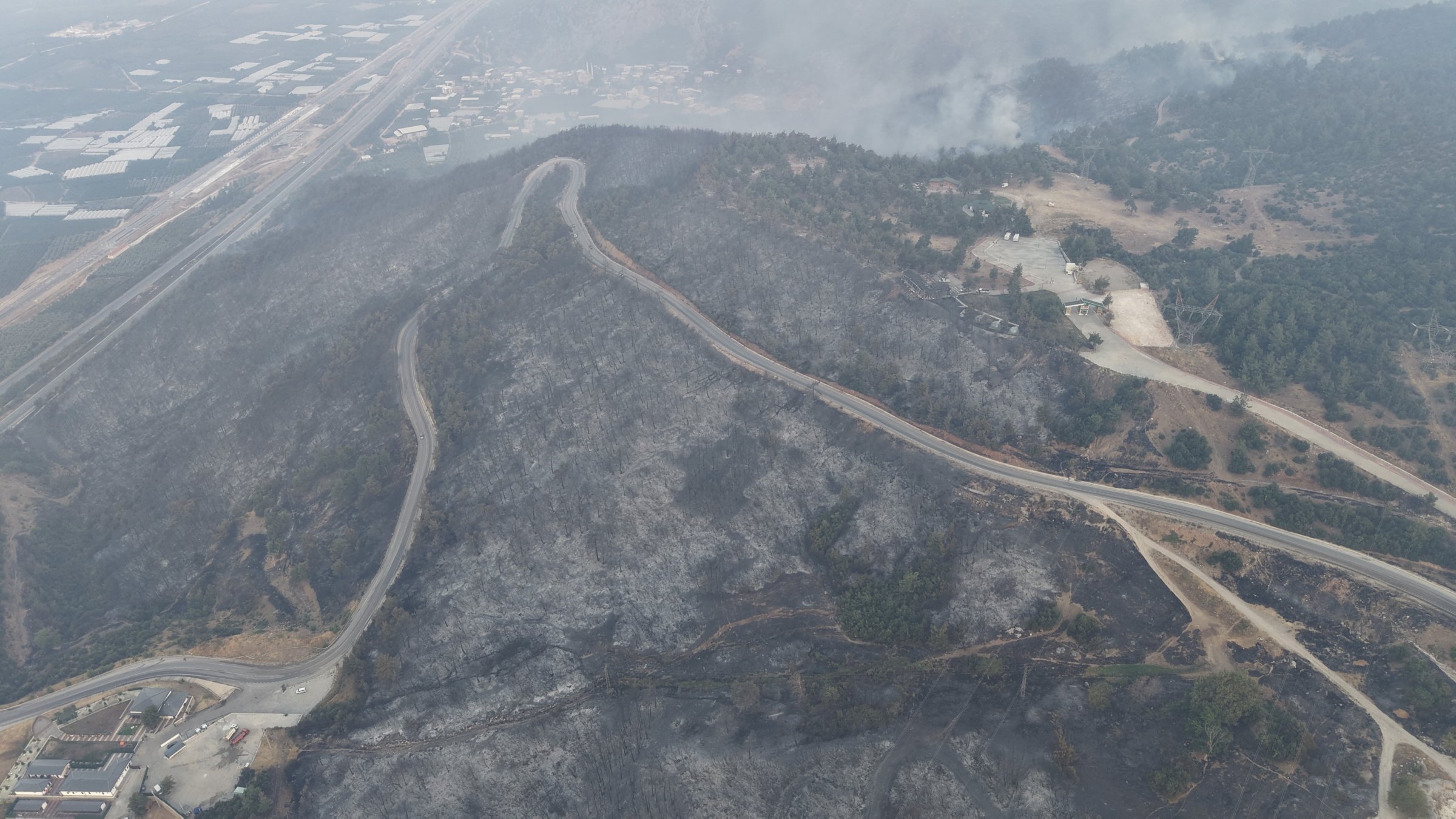 An aerial view shows burned pine forests after the wildfire in Gürsu, Bursa, Türkiye, July 27, 2025. (IHA Photo)