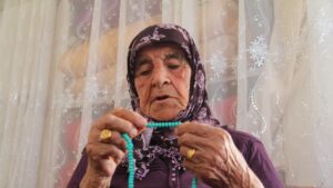 Ayşe Uğur, 101, with her prayer beads at her home, Gaziantep, Türkiye, July 30, 2025. (IHA Photo)