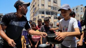 Palestinians gather to receive food from a charity kitchen, amid a hunger crisis, in Nuseirat, Gaza Strip, Palestine, July 29, 2025. (Reuters Photo)