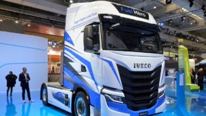 Members of the media stand behind an Iveco S-Way truck at the booth of truck-maker Iveco at the IAA Transportation fair, Hanover, Germany, Sept. 19, 2022. (Reuters Photo)