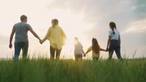 Parents spend time outside with their children. (Shutterstock Photo)