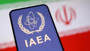 The International Atomic Energy Agency (IAEA) logo and the Iranian flag are seen in this illustration taken June 16, 2025. (Reuters Photo)