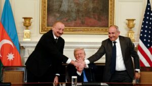 (L-R) Azerbaijan's President Ilham Aliyev, U.S. President Donald Trump and Armenia's Prime Minister Nikol Pashinyan join hands during a signing ceremony in the State Dining Room of the White House, Washington, U.S., Aug. 8, 2025. (EPA Photo)