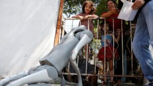 Waldog, a robotic dog used by Mexican Senator Waldo Fernandez as a tool to raise awareness about animal adoption and abuse, greets people during a street tour, Guadalupe, Mexico, Aug. 8, 2025. (Reuters Photo)